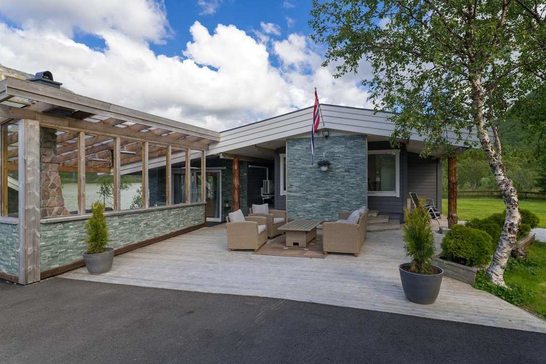 Vesterålen Lodge — the outdoor terrace and lounge entrance with mountain views