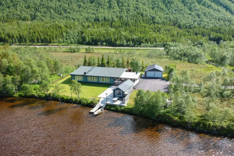 The property seen from the air. Lovely location right by the lake. Own rowing boat for fishing in the lake and very open area.