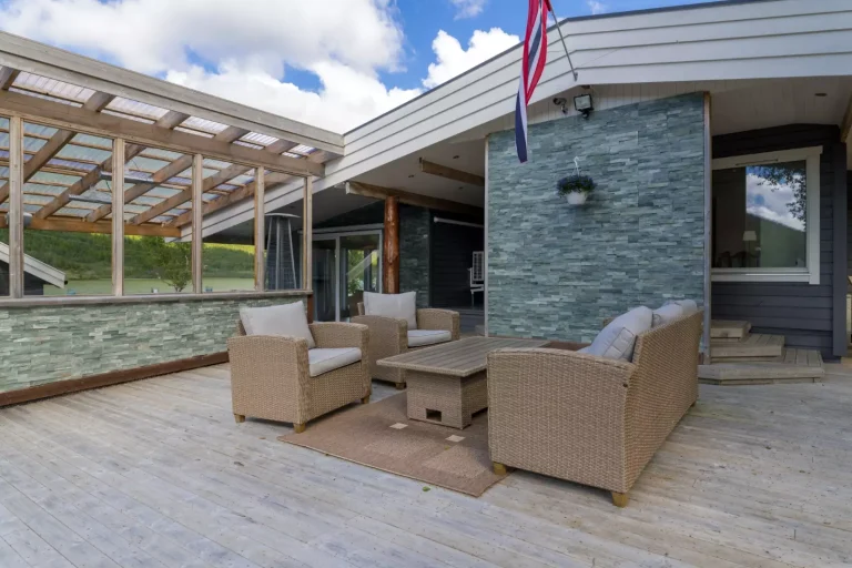 Entrance area and large patio for playing with children or enjoying quiet time after a mountain trip.