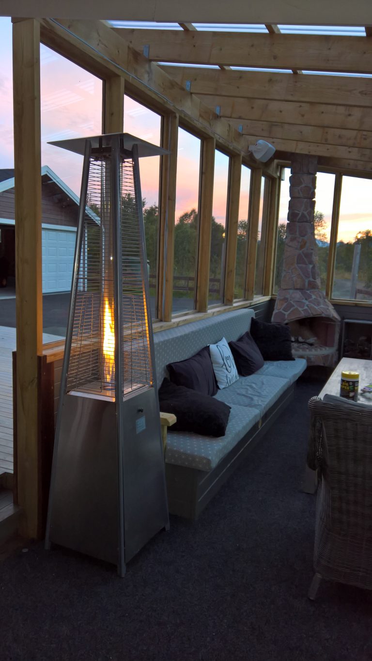 The conservatory in the evening atmosphere, here you can light the fireplace and use the gas tower for heat and light.